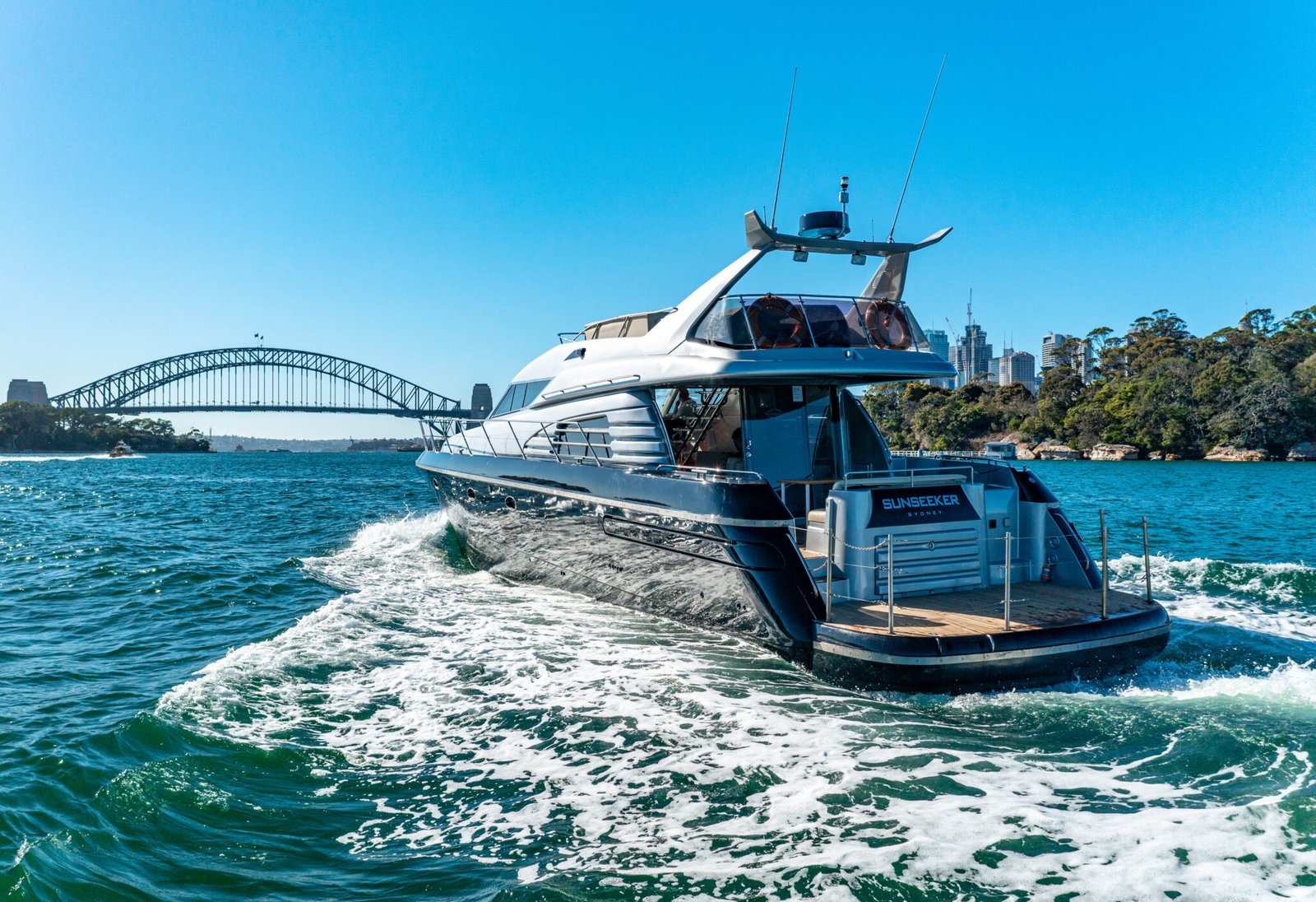 MV Sunseeker departing from a secluded Sydney cove.