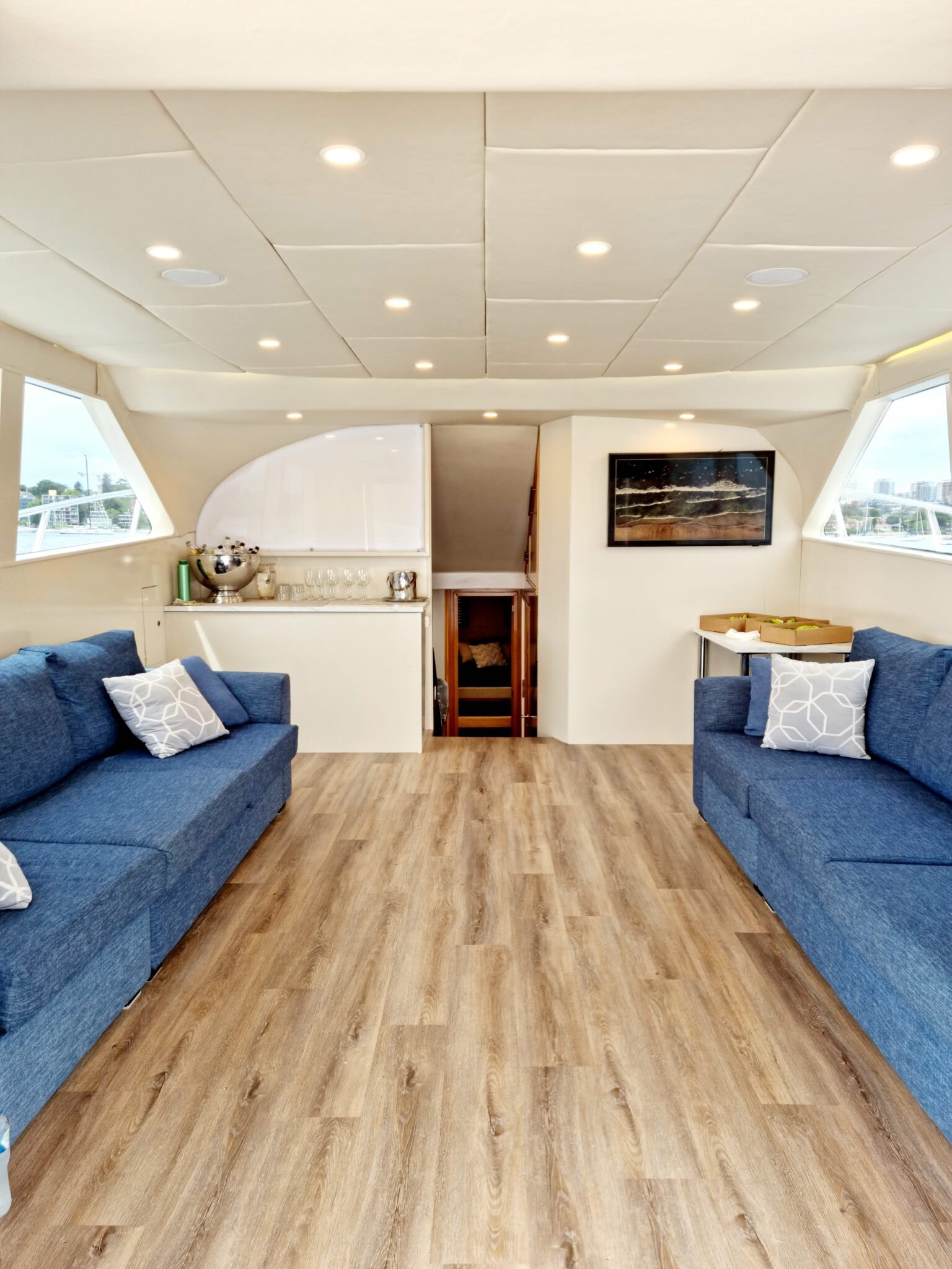 Spacious interior lounge with timber flooring on MV state of the art.