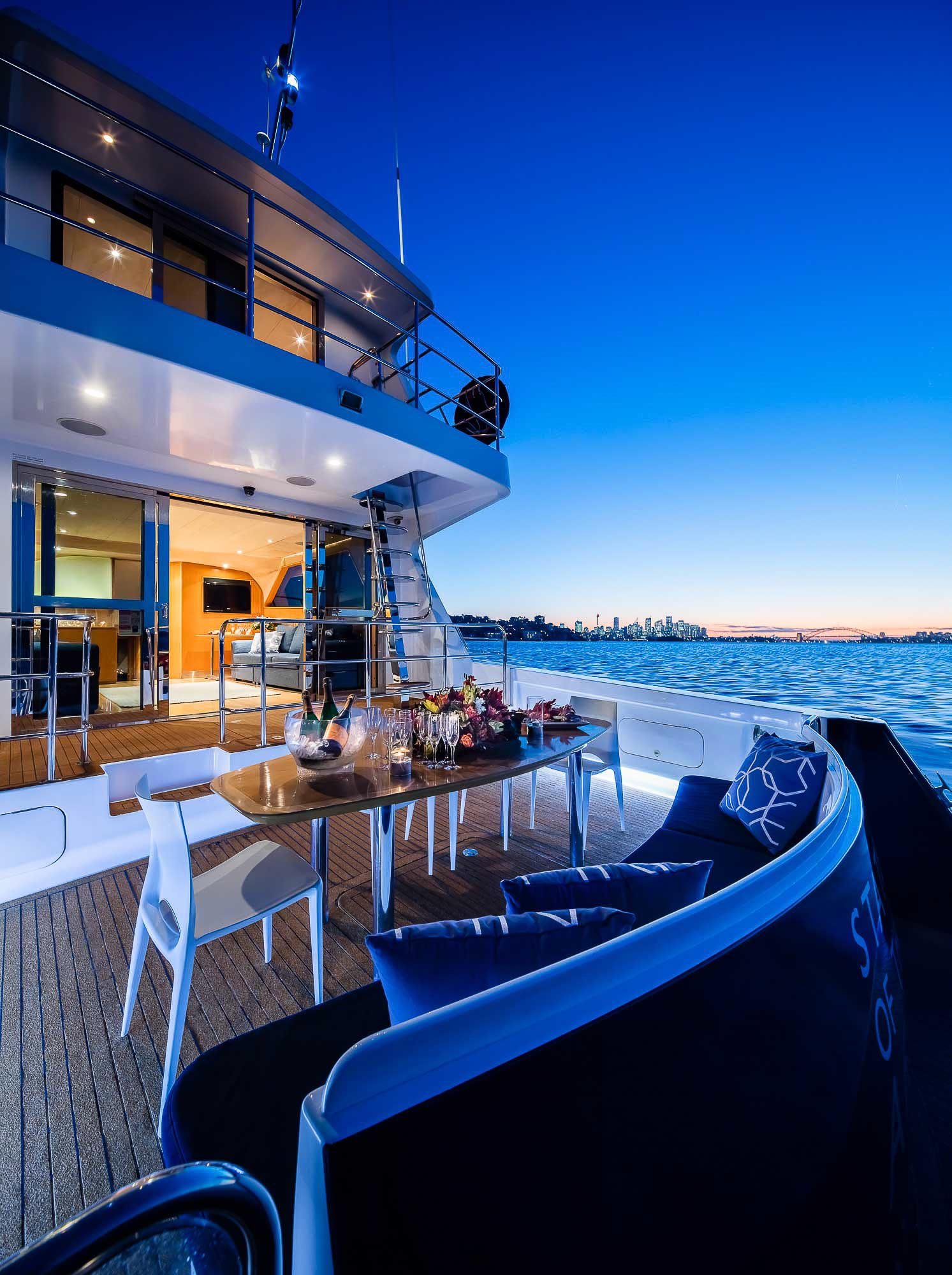 Sunset dining setup on rear deck of MV State of the art.