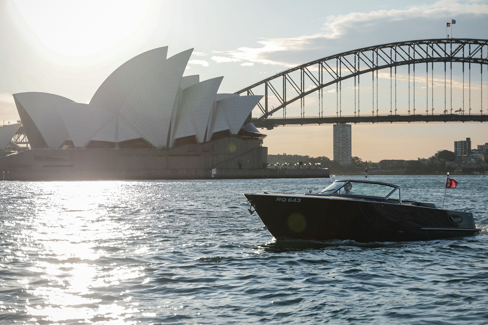 MV Aquamajestic cruising past Sydney Harbour Bridge and Opera House
