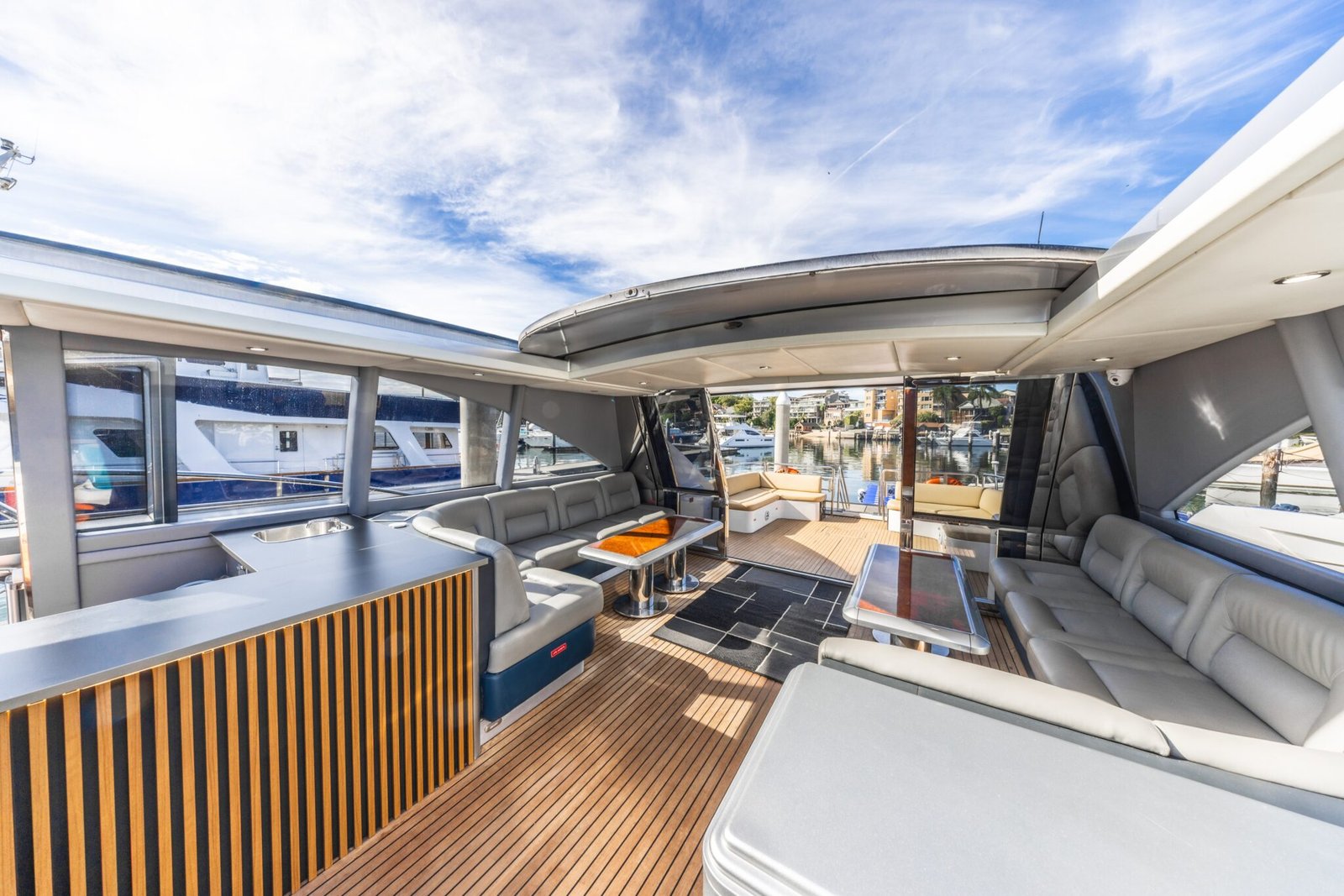 Rear outdoor deck with timber finish and harbour views on MV Gravity