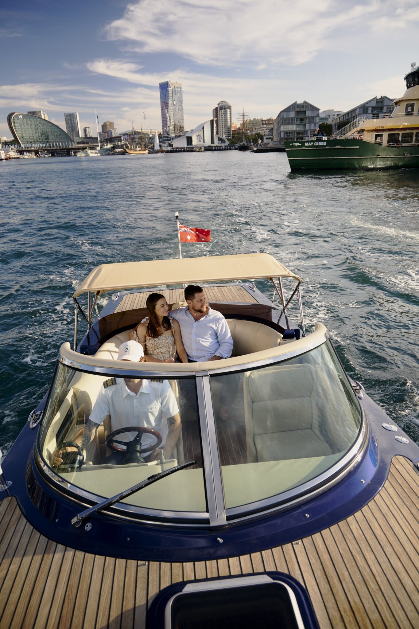MV Aquamajestic cruising on Sydney Harbour at sunset.